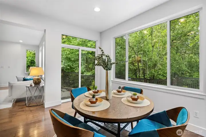 Kitchen nook leads to outside with load of privacy in backyard