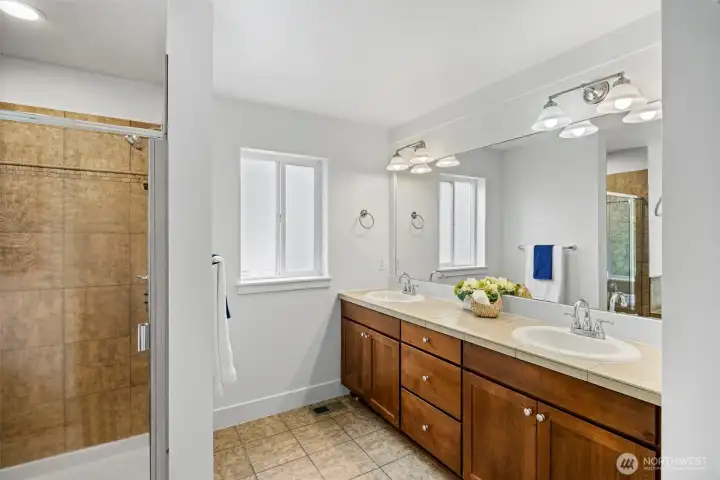 Double sink and fully tiled shower