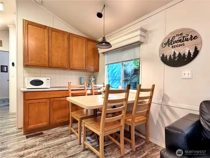 Tons of kitchen storage including this coffee area with retro microwave.