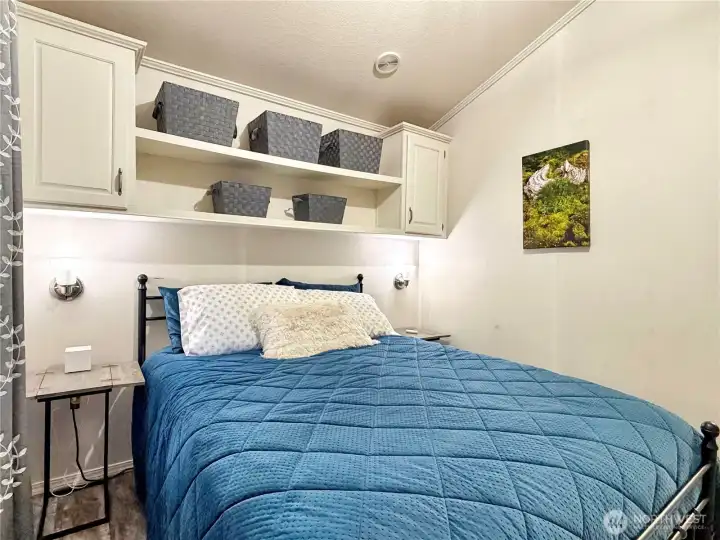 Lots of storage in the bedroom, including the shelves/baskets seen here. The night tables have USB and regular outlets on the backs of them for convenient charging of devices.