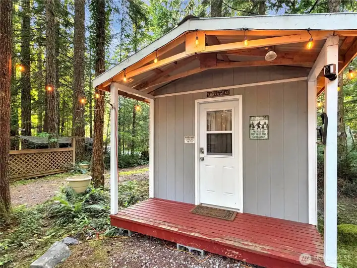 The shed has a covered porch.