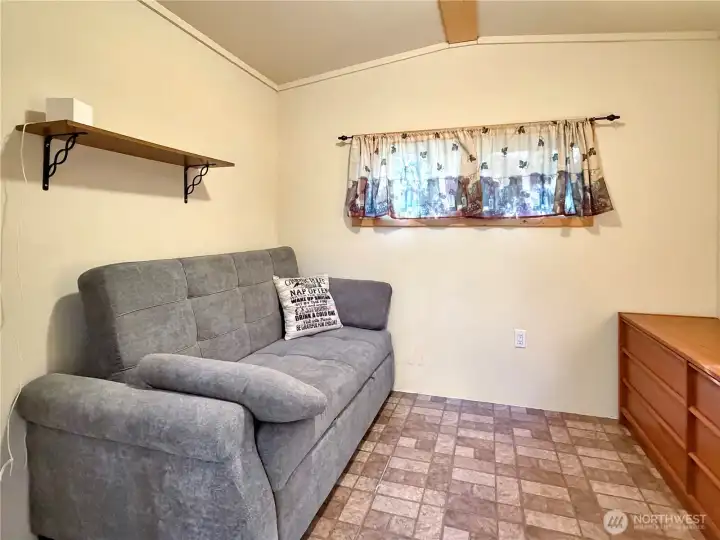 Inside the shed. The couch converts to a queen bed.