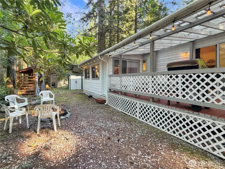 Lower deck lattice lifts for under deck storage. Two storage sheds in the back that are great for garden tools, skis, sleds, pool noodles or whatever you need to tuck out of the elements and out of sight.