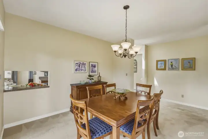 Spacious formal dining room with convenient pass-through to the kitchen. Spacious formal dining room with convenient pass-through to the kitchen.
