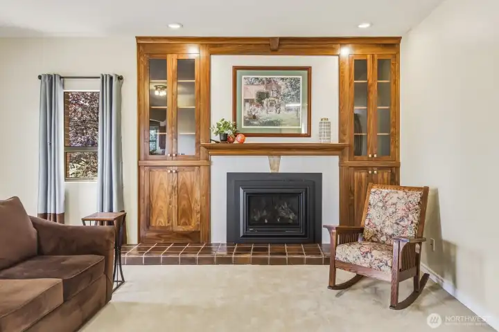 Another view of recently completed cabinetry, woodwork & tile surrounding cozy fireplace. Another view of recently completed cabinetry, woodwork & tile surrounding cozy fireplace.
