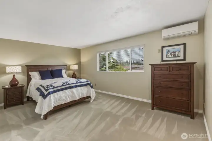 view of absoultely huge primary bedroom with air conditioning. view of absoultely huge primary bedroom with air conditioning.