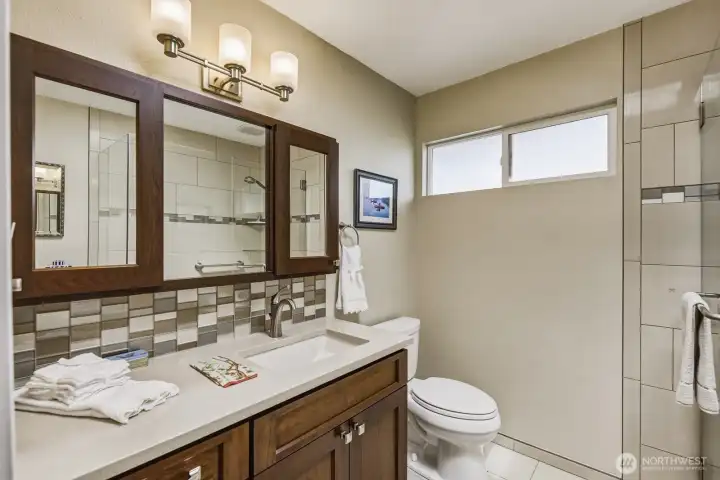 Primary bath heated tile floors, all high end fixtures, and awesome walk-in shower to the right. Primary bath heated tile floors, all high end fixtures, and awesome walk-in shower to the right.