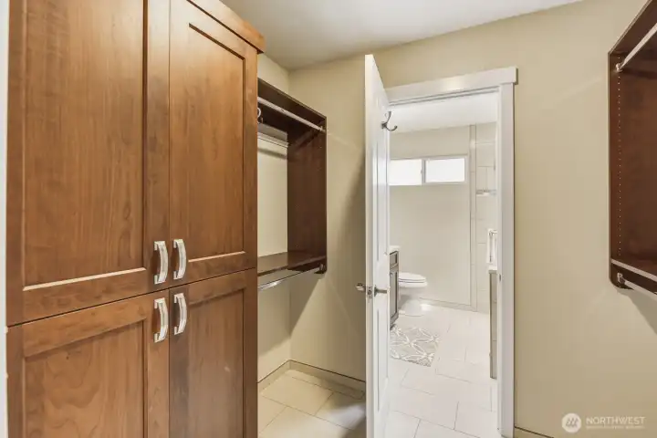 Another view of custom woodwork in walk-in closet. Another view of custom woodwork in walk-in closet.