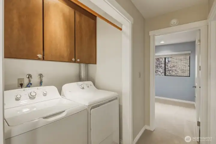 Utility with newer washer & dryer that remain and door to den/office to the right. Utility with newer washer & dryer that remain and door to den/office to the right.