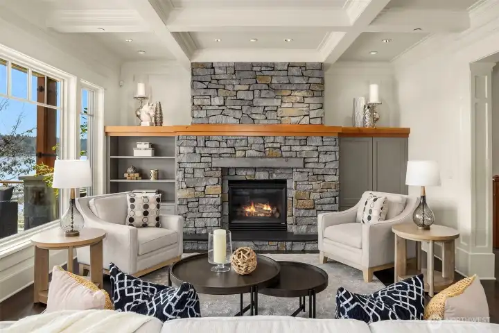 A statement making stacked stone fireplace serves as an anchor in the Great Room offering the space weight, warmth and undeniable presence. A statement making stacked stone fireplace serves as an anchor in the Great Room offering the space weight, warmth and undeniable presence.