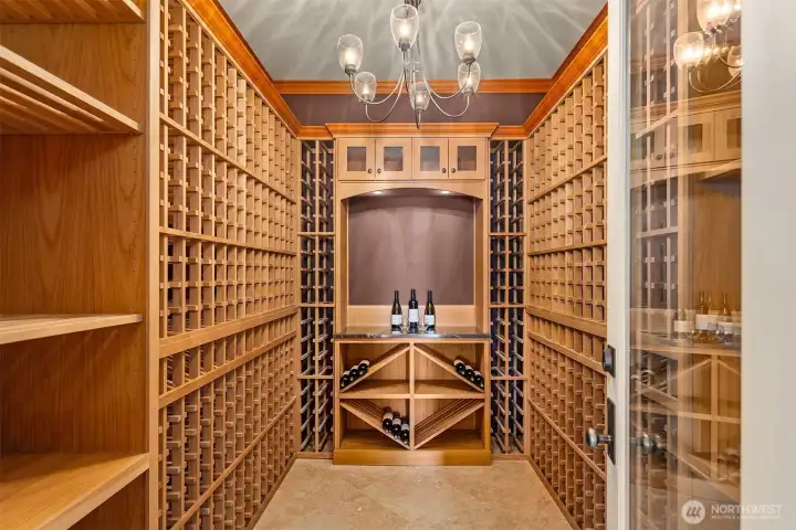 An impressive 900+ bottle wine cellar stands ready for collectors, offering the perfect environment for aging, showcasing and savoring every bottle. An impressive 900+ bottle wine cellar stands ready for collectors, offering the perfect environment for aging, showcasing and savoring every bottle.