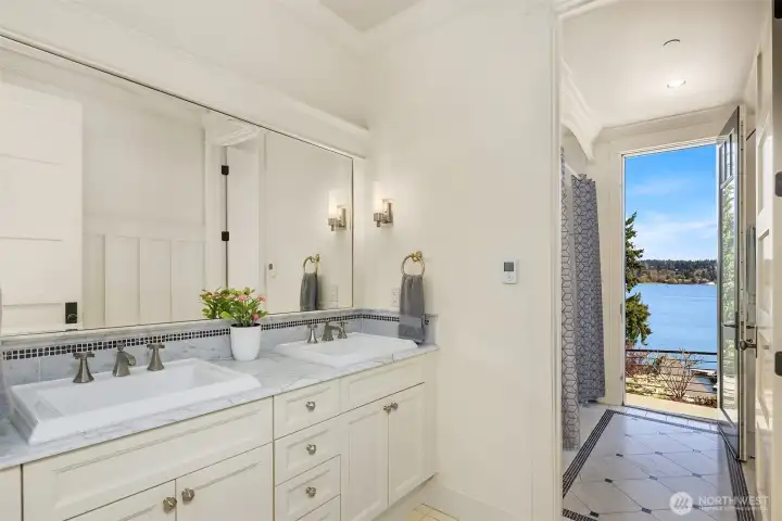 Another beautifully appointed full bathroom where marble slab counters and classic tile patterns bring timeless character to the space. Another beautifully appointed full bathroom where marble slab counters and classic tile patterns bring timeless character to the space.