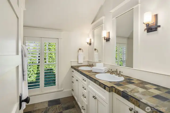 This lovely 3/4 bathroom features rich slate tilework creating a refined, textural and timeless finish. This lovely 3/4 bathroom features rich slate tilework creating a refined, textural and timeless finish.