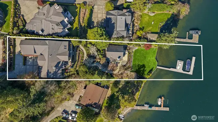 Set on a generous 1/2-acre parcel with 90 feet of commanding waterfront, this property delivers scale, privacy and undeniable presence. Set on a generous 1/2-acre parcel with 90 feet of commanding waterfront, this property delivers scale, privacy and undeniable presence.