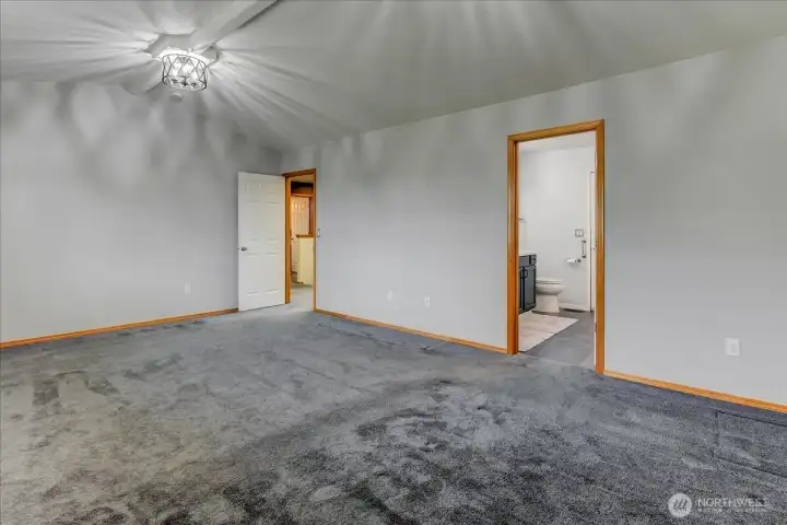 Another view of the primary bedroom