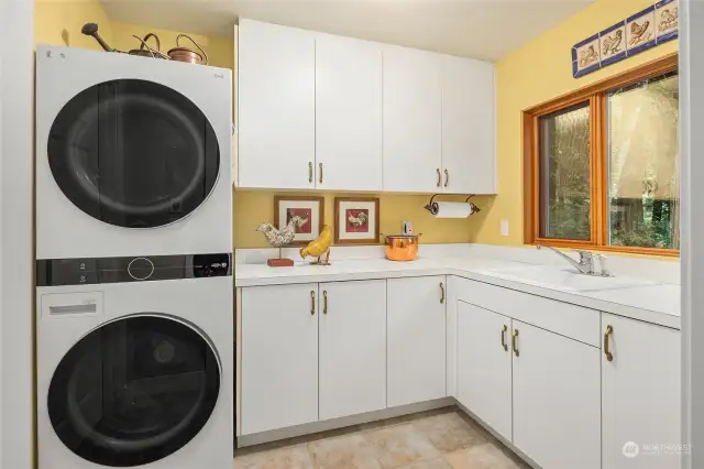 Laundry is a breeze from this bright open space just off the kitchen side door and mud room.