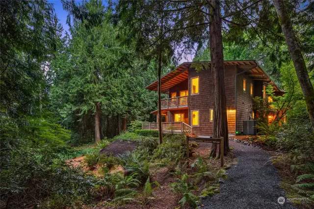 This extraordinary home is nestled under a canopy of trees within a private 5 acre site.