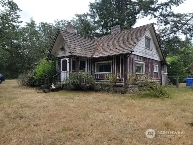 Ready for your touch!  1938 Log home, very solid, just needs love!