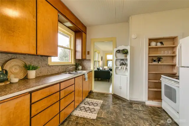 Kitchen has south-facing window and lots of storage