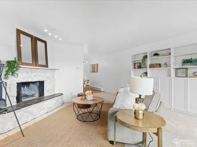 Wood burning fireplace and built in cabinets in the living room.