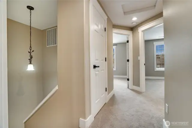 The upper level continues the home's refreshed elegance, featuring newer carpet for cozy comfort, updated hardware on the doors, and new millwork throughout. The timeless paint palette ties it all together, creating a harmonious and inviting atmosphere.