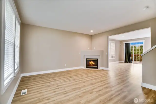 Step inside to admire the new Luxury Vinyl Flooring, enhanced baseboard trim, fresh paint, and updated blinds that add modern elegance throughout the main floor. Cozy up in front of the gas fireplace on a stormy northwest weekend. Designed with gatherings in mind, this home offers ample space for entertaining, making it perfect for hosting friends.