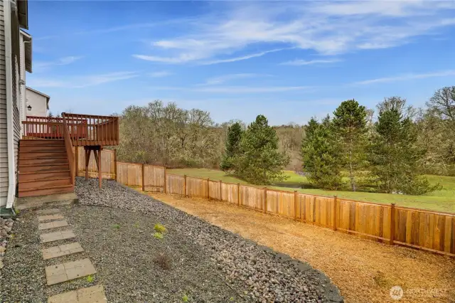 Significant resources and care were dedicated to terracing the large backyard, making it not only visually stunning but also far more accessible and practical for a variety of uses. The fencing is new too!