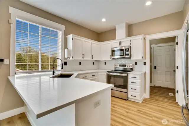 Sleek quartz countertops are the perfect addition to this refreshed kitchen.