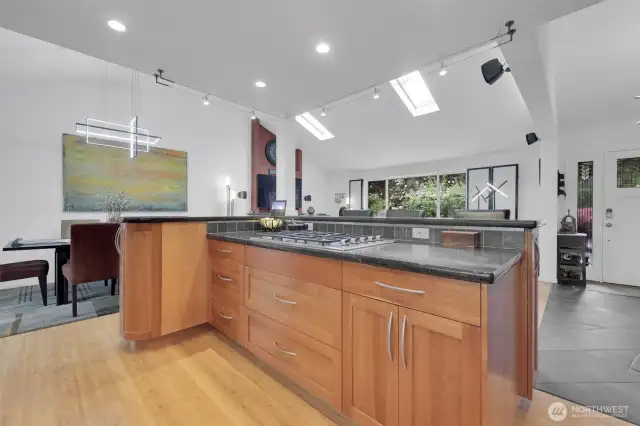 Large island with custom cabinets and granite counter tops. 5 burner gas cooktop.  Perfect for entertaining.
