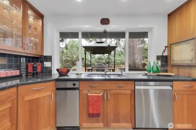 Built in trash compactor. Stainless appliances.
