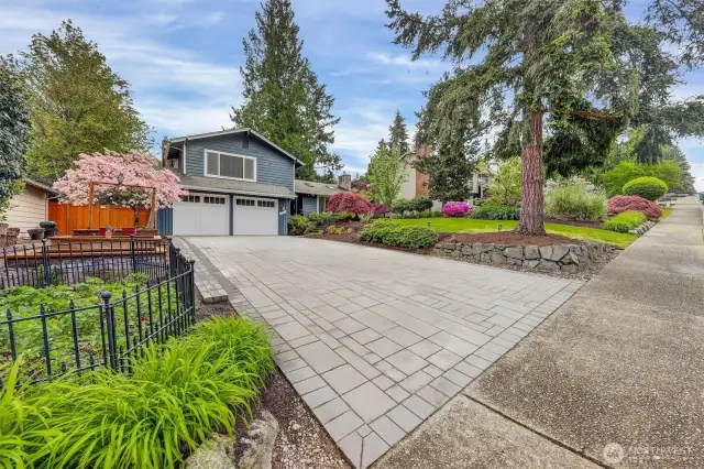 Garden space to the left of the driveway.  Quality new paver driveway.