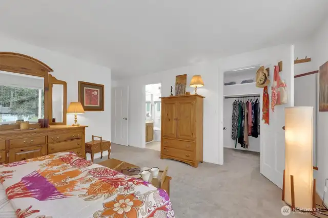 Primary bedroom with ensuite bath and walk-in closet.