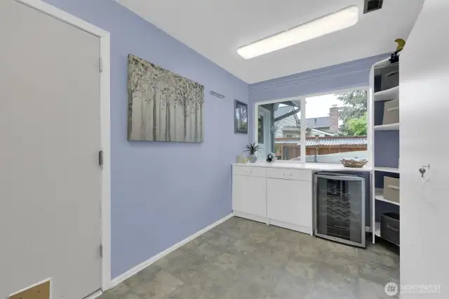 Laundry also includes a wine cooler.