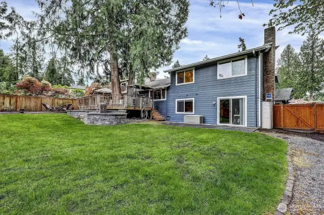 Fenced back yard, large shed, side yard kayak rack and storage.