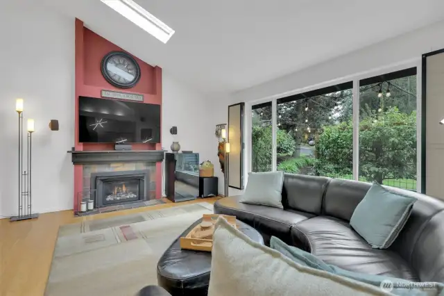 Gas fireplace & large picture window to enjoy the fruit trees and garden space.