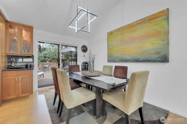 Sliding door off of dining room leads to large trex deck and park-like yard.