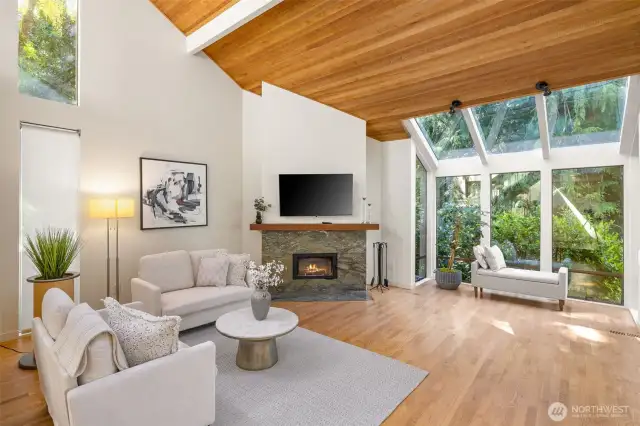 Formal living area with wood burning fireplace.