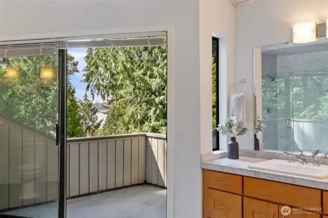 Updated primary bathroom with a deck with a beautiful views of lake WA.