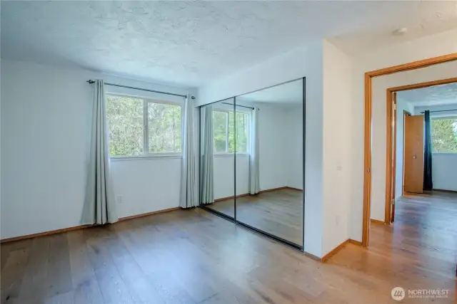 Main level bedroom with access from the hall - Primary bedroom across the hall