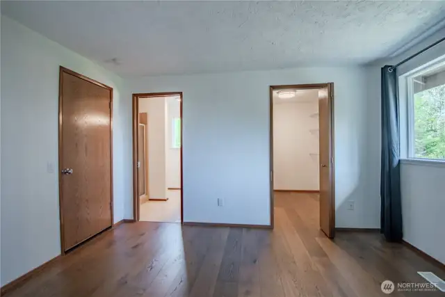 Private 3/4 bath and walk in closet in the main level primary bedroom