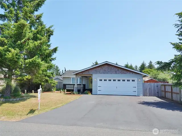 Large asphalt driveway leads to the 2-car Garage.