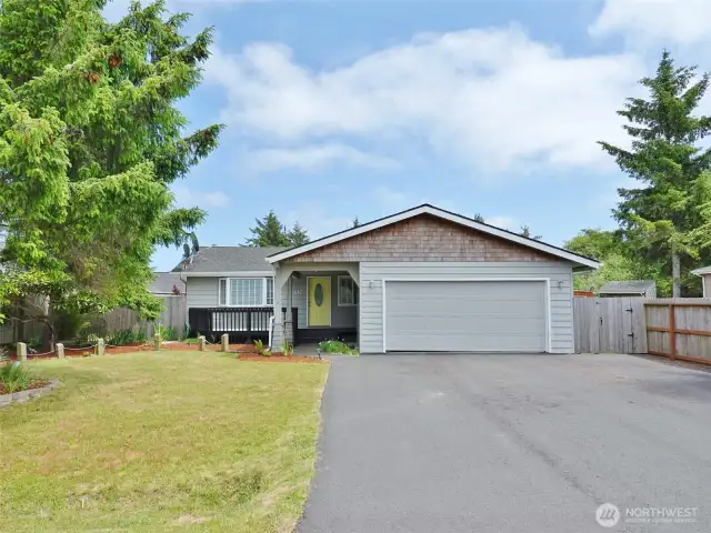 Large asphalt driveway leads to the 2-car Garage.