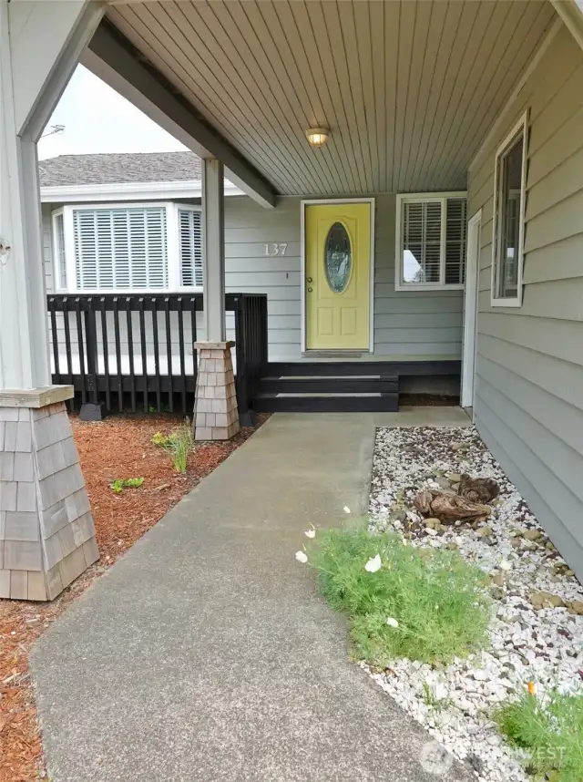 Covered Walkway leads to the Entry and Garage.