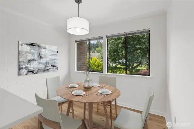 Virtually staged kitchen eating space with new light fixture.