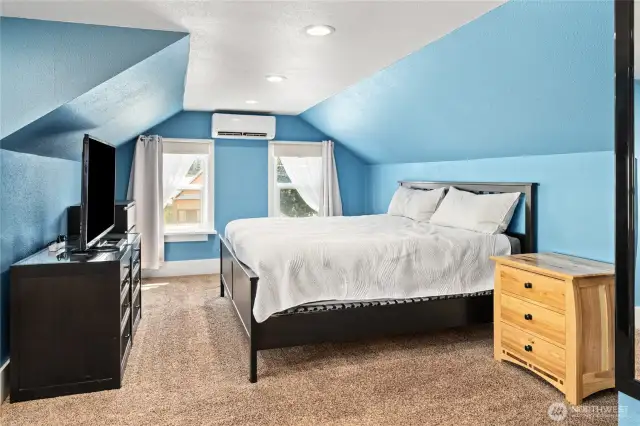 Upstairs primary bedroom with amazing views and a mini split to keep cool in the summer!