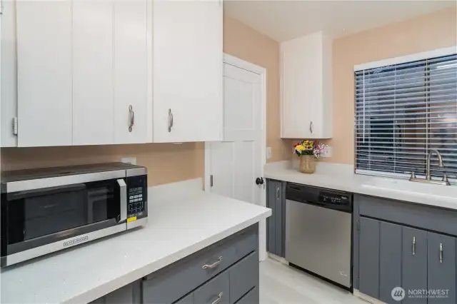 New Quartz Countertops with Easting space and Pantry area.