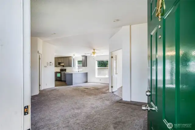 Upon entry, you will find the inviting living room.