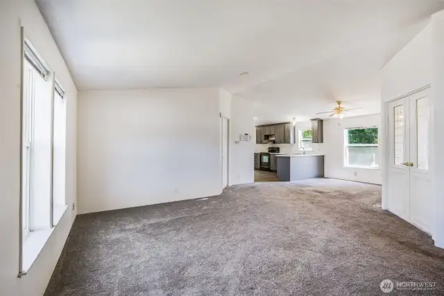 Bright and spacious living room with open-concept layout, perfect for seamless living and entertaining.