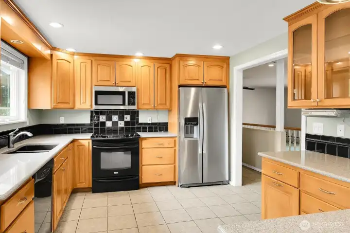 Updated and remodeled kitchen with lots of counterspace and cabinets.