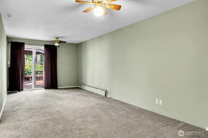 Formal dining room offers sliding glass door access to patio.